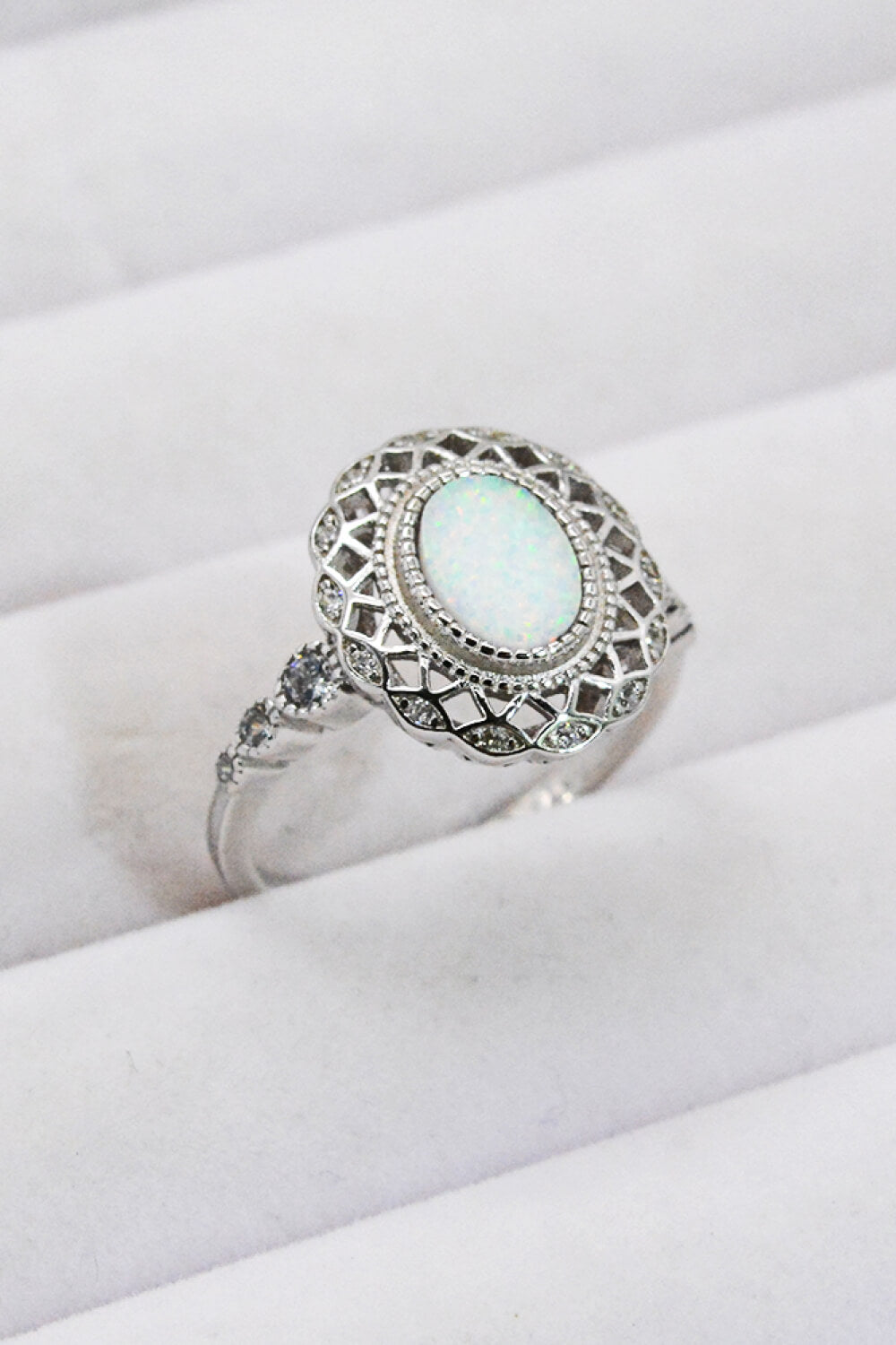 Feeling The Love 925 Sterling Silver Opal Ring displayed in a flat lay style, showcasing its minimalist design and opal stone.